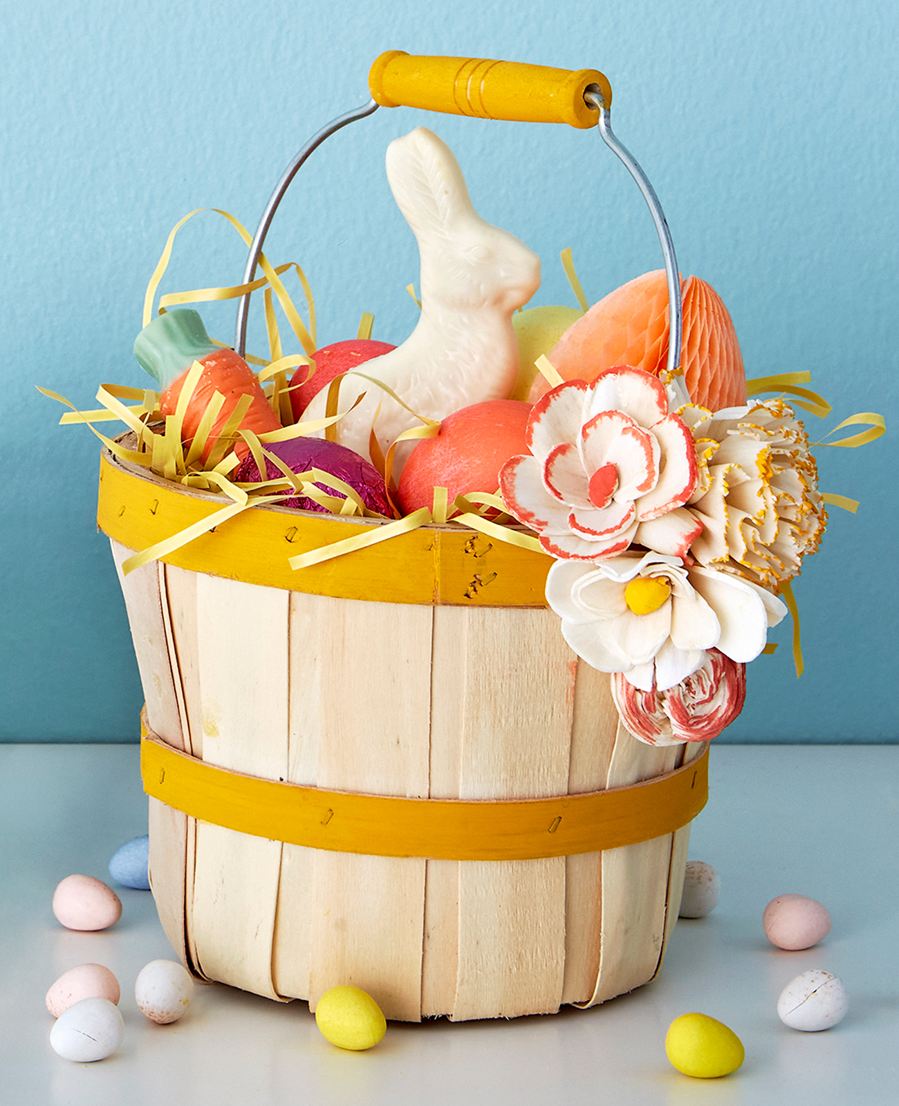 Half-peck basket blooming with painted wooden flowers