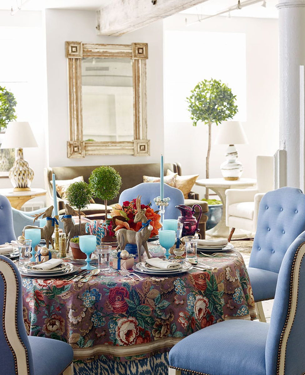 Dining room vignette of holiday table setting in blue and purple tones