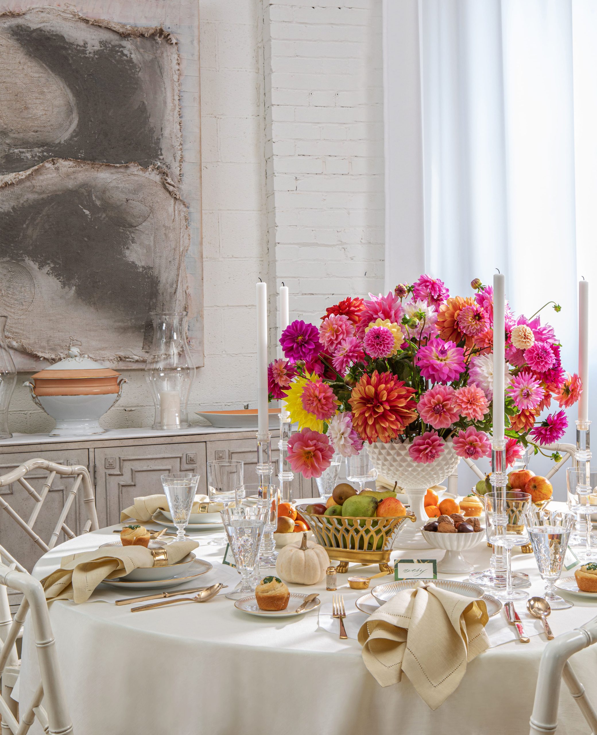 Dining room setup in our Loft studio with brightly colored floral centerpiece